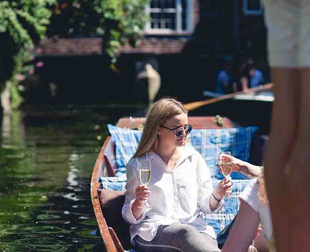 Group enjoying a punting tour on the River Stour