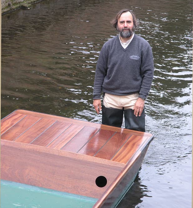 Canterbury punt builder standing beside a traditionally crafted hardwood punt